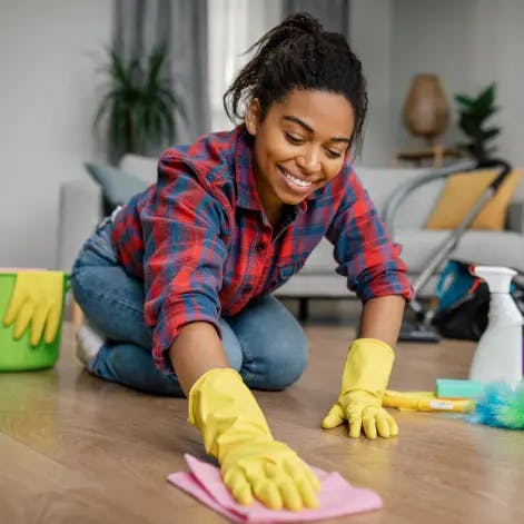 a lady cleaning the floor